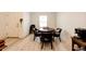 Cozy dining area with a round table, seating for four, and a Keurig coffee machine at 316 Maple St, Bennett, CO 80102