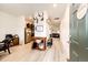 Inviting entryway with light wood floors, decorative accents, and an open view of the living area at 316 Maple St, Bennett, CO 80102