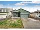 Charming single Gathering home with a well-manicured lawn, covered porch, and two-car garage at 316 Maple St, Bennett, CO 80102