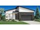 Modern home featuring stone accents, a two-car garage, and professionally landscaped lawn at 6353 Verve Ln, Parker, CO 80134