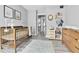 Cozy Bedroom featuring a wooden crib, soft rug, and ample storage space at 3331 S Monaco Pkwy # C, Denver, CO 80222