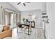 Dining area with modern table set, access to a balcony, and stylish black buffet at 3331 S Monaco Pkwy # C, Denver, CO 80222