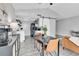 Dining area with modern table and chairs adjacent to a stylish kitchen and a comfortable living area at 3331 S Monaco Pkwy # C, Denver, CO 80222