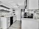 Bright kitchen with white cabinetry, stainless steel appliances, and modern backsplash at 3331 S Monaco Pkwy # C, Denver, CO 80222
