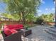 Charming backyard patio with a seating area, stone pavers, and lush landscaping at 9816 S Holland St, Littleton, CO 80127