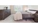 A cozy bedroom features a queen-sized bed and a large dresser, creating a warm and inviting atmosphere at 9816 S Holland St, Littleton, CO 80127