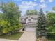 Lovely two-story home with a well-manicured lawn and a two car garage at 9816 S Holland St, Littleton, CO 80127