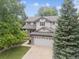 Beautiful two-story home with a well-manicured lawn and a two car garage at 9816 S Holland St, Littleton, CO 80127