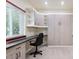 This room features a built-in desk, storage, and a murphy bed, providing a versatile space for work and rest at 9816 S Holland St, Littleton, CO 80127