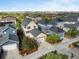 Aerial view showcasing the property surrounded by a well-maintained neighborhood and mature trees at 10822 E 28Th Pl, Denver, CO 80238