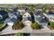 Aerial view of a neighborhood highlighting diverse home styles, solar panels, and manicured yards at 10822 E 28Th Pl, Denver, CO 80238
