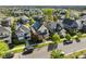Aerial shot showcasing a neighborhood, trees, street, and home at 10822 E 28Th Pl, Denver, CO 80238