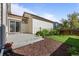 Backyard patio and landscaping with a small yard at 10822 E 28Th Pl, Denver, CO 80238