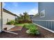 Landscaped backyard with grass and bark at 10822 E 28Th Pl, Denver, CO 80238