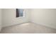 Basement with carpet and a window at 10822 E 28Th Pl, Denver, CO 80238