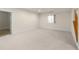 Spacious basement with carpet, window and white trim at 10822 E 28Th Pl, Denver, CO 80238