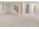 Finished basement with stairs leading to the main floor at 10822 E 28Th Pl, Denver, CO 80238
