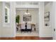 Elegant dining room featuring a modern chandelier and neutral tones, perfect for gatherings at 10822 E 28Th Pl, Denver, CO 80238