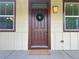 Charming front door with a seasonal wreath, warm lighting, and decorative house numbers at 10822 E 28Th Pl, Denver, CO 80238