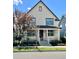 Charming two-story home with a cozy front porch and well-maintained landscaping at 10822 E 28Th Pl, Denver, CO 80238