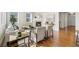 Cozy living room featuring hardwood floors, a fireplace and ample natural light at 10822 E 28Th Pl, Denver, CO 80238