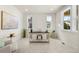 Bright office space with natural light, neutral walls, and a stylish work area at 10822 E 28Th Pl, Denver, CO 80238