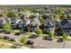 Street view of a charming neighborhood with lush trees and well-kept homes with front porches at 10822 E 28Th Pl, Denver, CO 80238