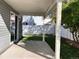 Backyard features a covered patio and lawn area, perfect for relaxing and enjoying the outdoors in privacy at 5566 Flanders St, Denver, CO 80249