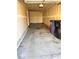 Spacious two-car garage ready for storage and vehicles, and trash and recycling bins at 5566 Flanders St, Denver, CO 80249