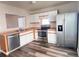 Modern kitchen with stainless steel appliances, abundant counter space, and ample cabinets for all your culinary needs at 5566 Flanders St, Denver, CO 80249