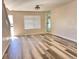 Inviting living room with hardwood floors and a large window, creating a warm and welcoming atmosphere at 5566 Flanders St, Denver, CO 80249