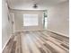 Spacious living room with modern hardwood flooring and natural light, ready for relaxation and entertainment at 5566 Flanders St, Denver, CO 80249
