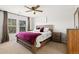 Main bedroom with ceiling fan and wood furniture at 17101 Waterhouse Cir # B, Parker, CO 80134