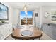 Dining area with wooden table, four chairs, and sliding doors at 17101 Waterhouse Cir # B, Parker, CO 80134