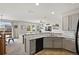 Modern kitchen with gray cabinets and granite countertops at 17101 Waterhouse Cir # B, Parker, CO 80134