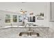 Granite countertops and stainless steel appliances highlight this kitchen at 17101 Waterhouse Cir # B, Parker, CO 80134