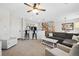 Open concept living room with kitchen island and staircase at 17101 Waterhouse Cir # B, Parker, CO 80134