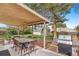Enjoy outdoor dining under the covered patio with a grill and spacious backyard at 2756 S Linley Ct, Denver, CO 80236