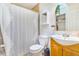 Functional bathroom with a shower, sink, toilet, and storage shelves, designed for comfort and practicality at 2756 S Linley Ct, Denver, CO 80236
