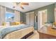 Cozy bedroom featuring a ceiling fan, large window, and closet, offering a relaxing and inviting space at 2756 S Linley Ct, Denver, CO 80236