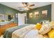 Comfortable bedroom with a ceiling fan, wood dresser, and decorative wall art, creating a serene atmosphere at 2756 S Linley Ct, Denver, CO 80236