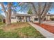 Charming single-story home with a well-maintained front yard, sidewalk and mature trees at 2756 S Linley Ct, Denver, CO 80236