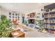 Spacious and airy living room featuring stylish decor, including plants and a television at 2756 S Linley Ct, Denver, CO 80236