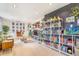 Open living room with bookshelves and an aquarium providing an airy and bright space at 2756 S Linley Ct, Denver, CO 80236