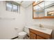 Clean basement bathroom with vanity and mirrored medicine cabinet at 12019 W Mexico Ave, Lakewood, CO 80228