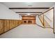 Finished basement with fireplace and built-in shelving at 12019 W Mexico Ave, Lakewood, CO 80228