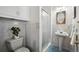 Clean bathroom with pedestal sink and shower/tub combo at 12019 W Mexico Ave, Lakewood, CO 80228