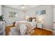 Bright bedroom with hardwood floors and a comfortable bed at 12019 W Mexico Ave, Lakewood, CO 80228