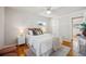 Well-lit bedroom featuring hardwood floors and ample space at 12019 W Mexico Ave, Lakewood, CO 80228