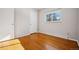 Simple bedroom with hardwood floors and neutral walls at 12019 W Mexico Ave, Lakewood, CO 80228